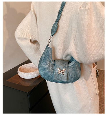 Populaire nouveau sac de niche de conception féminine tendance style étranger sac papillon sens avancée de toutes les épaules sac sous-bracelet