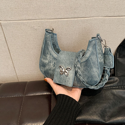 Populaire nouveau sac de niche de conception féminine tendance style étranger sac papillon sens avancée de toutes les épaules sac sous-bracelet