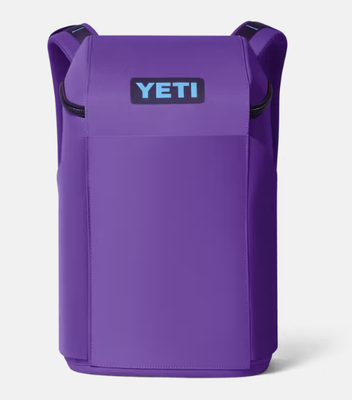 Sac à dos étanche avec système élastique avant stylé, deux poches pour bouteilles d'eau et poignées de transport équilibrées sur le dessus